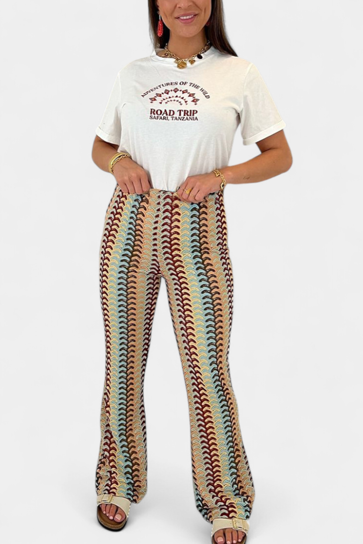 Rozevláté kalhoty s retro potiskem Carlie